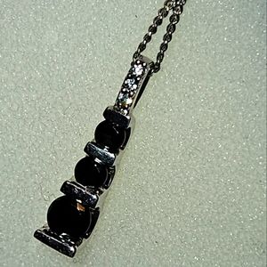 Very Dark Blue Sapphire. 925.	°Sterling Silver pendant with Chain.